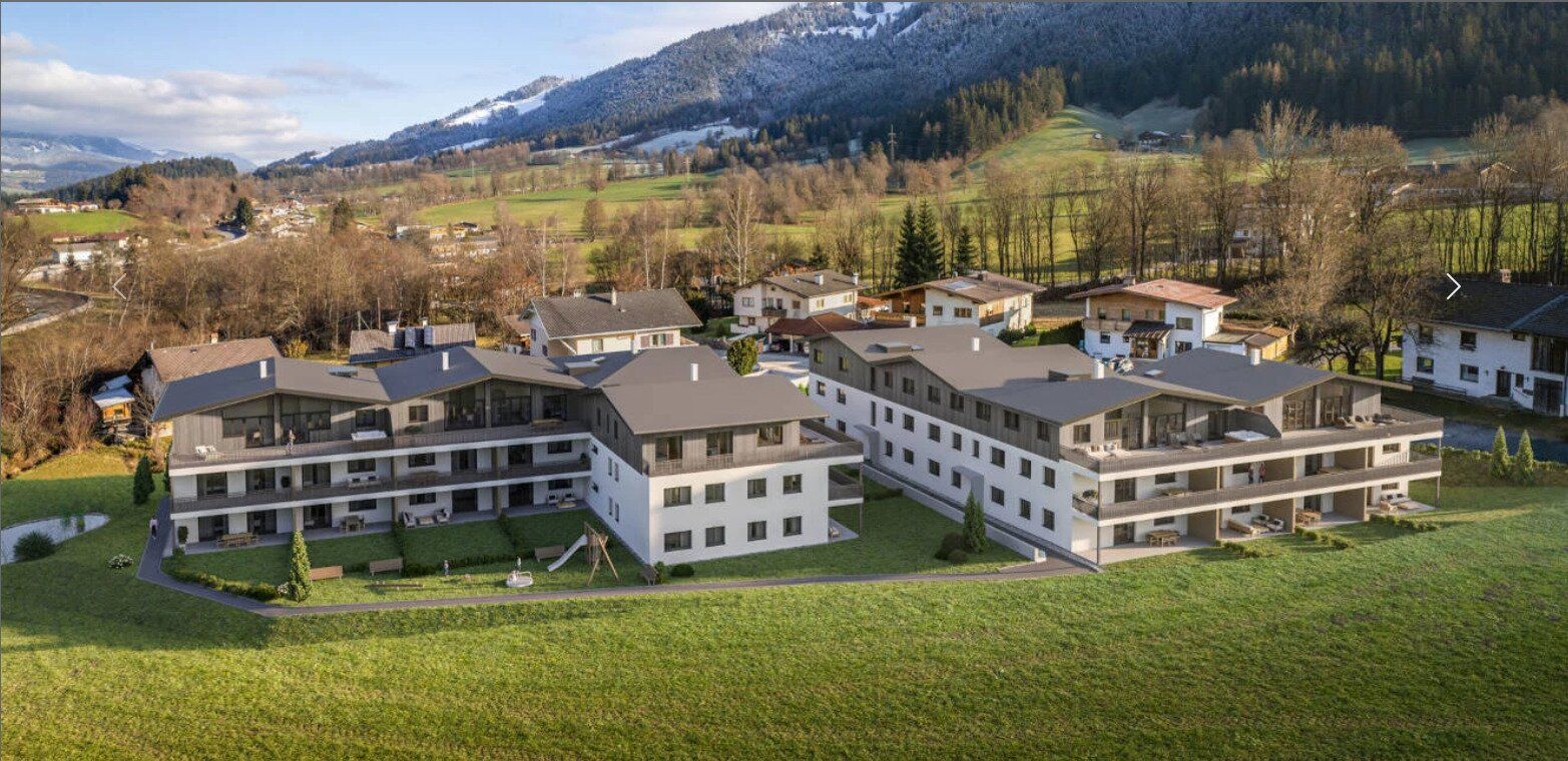 Optimal aufgeteilte DG-Wohnung A13 in Söll: Erstbezug mit Terrasse, Bergblick & Tiefgarage