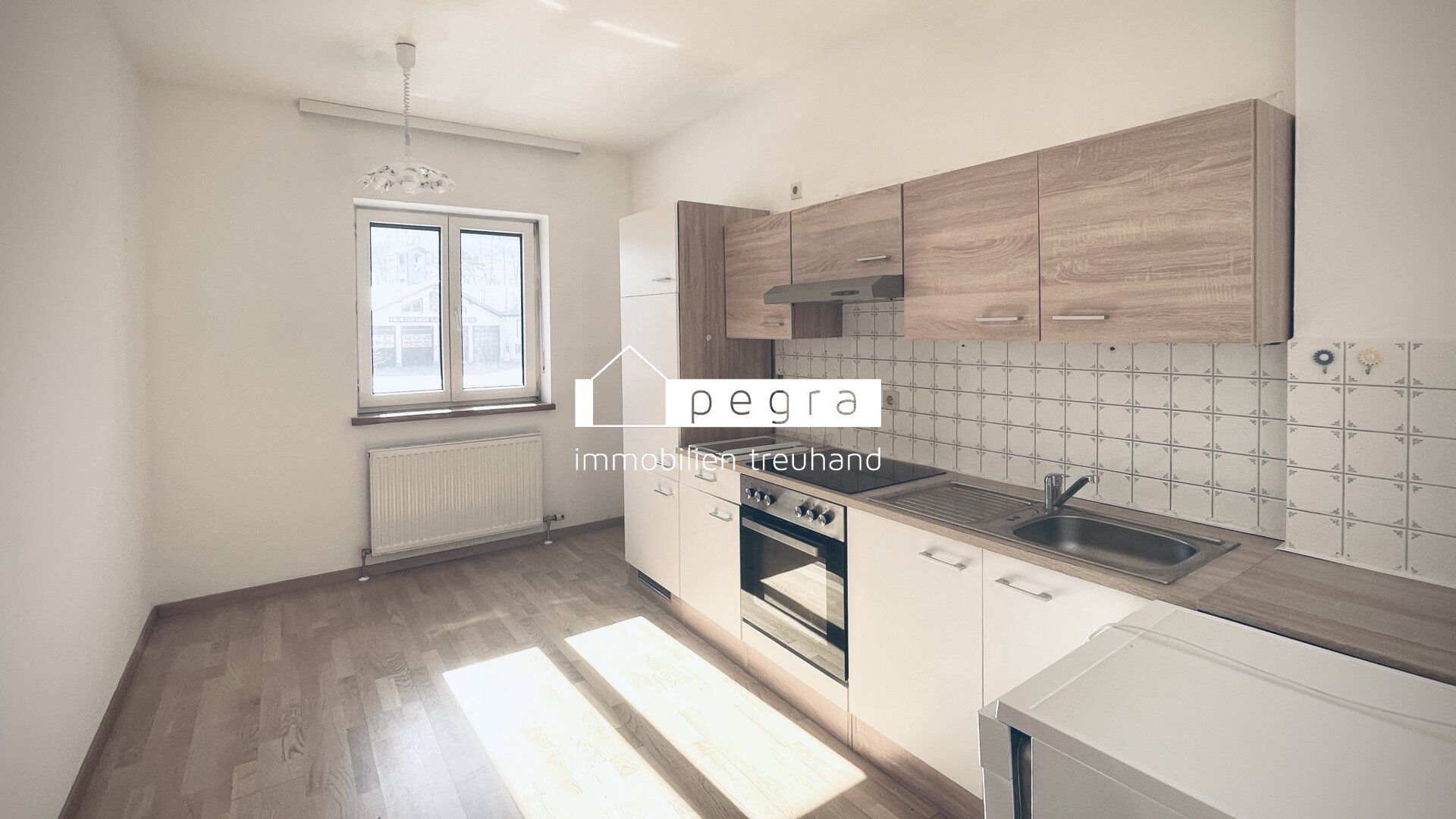 Top 2: Gemütliche 2-Zimmer-Wohnung mit separater Küche und PKW-Stellplatz
