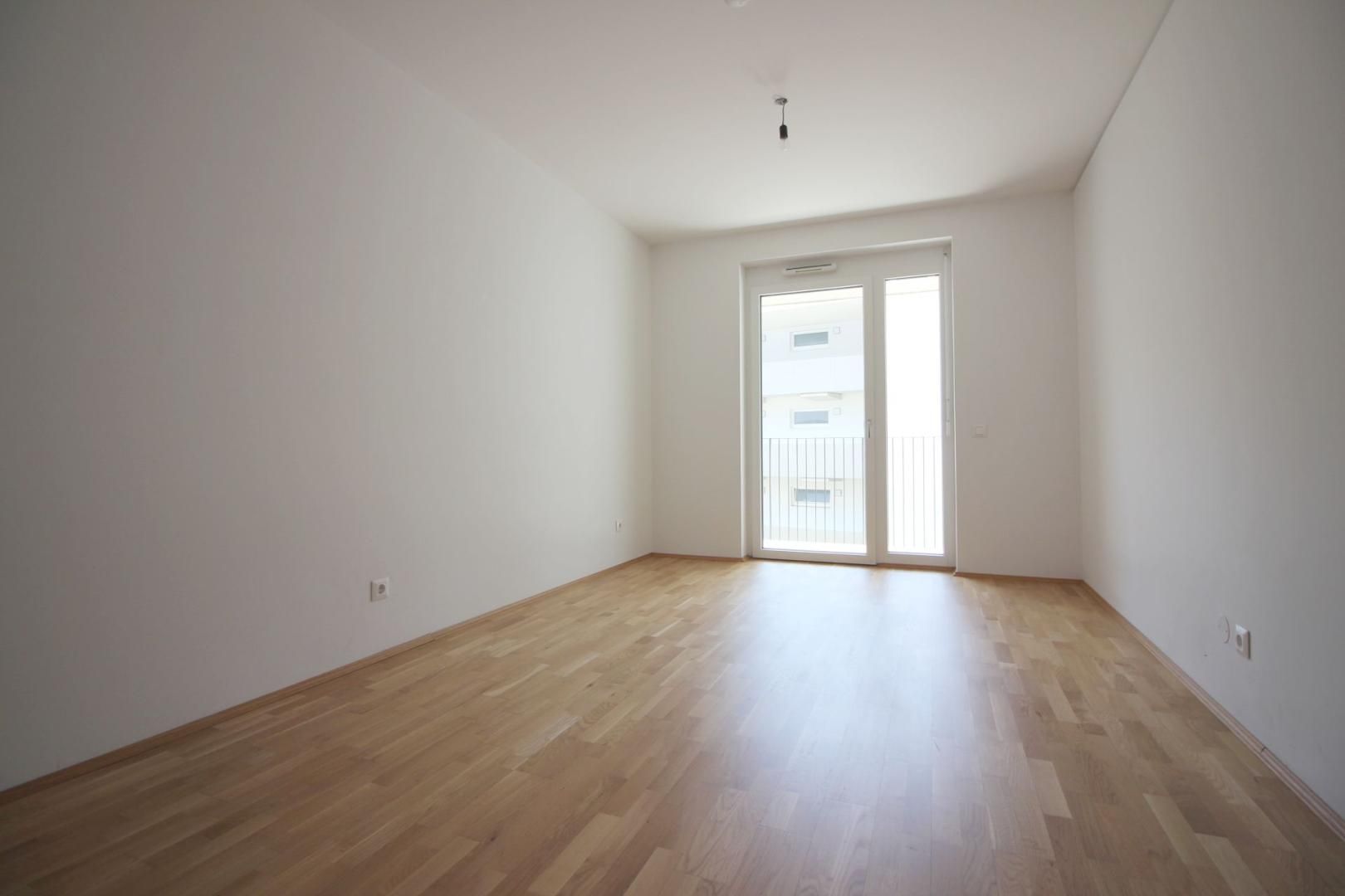MODERNE 2-ZIMMER-WOHNUNG MIT GROSSEM BALKON UND TIEFGARAGENPLATZ