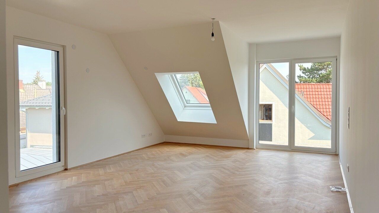 Moderne Architektur inmitten der Natur - Hochwertige Dachgeschoss 3-Zimmer Wohnung mit Balkon!