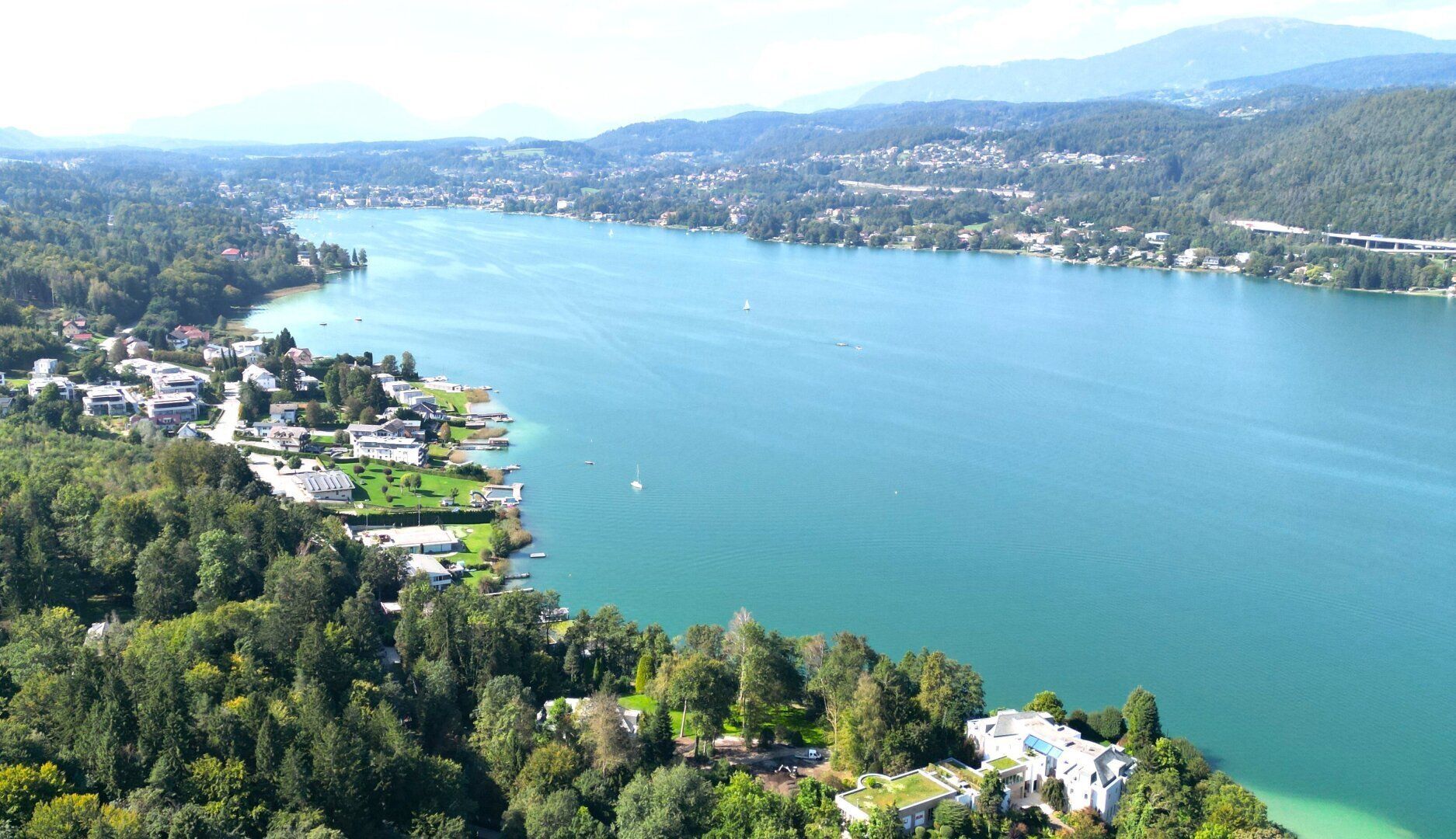 Gartenwohnung mit teilweisem Wörtherseeblick! Möblierter Erstbezug!