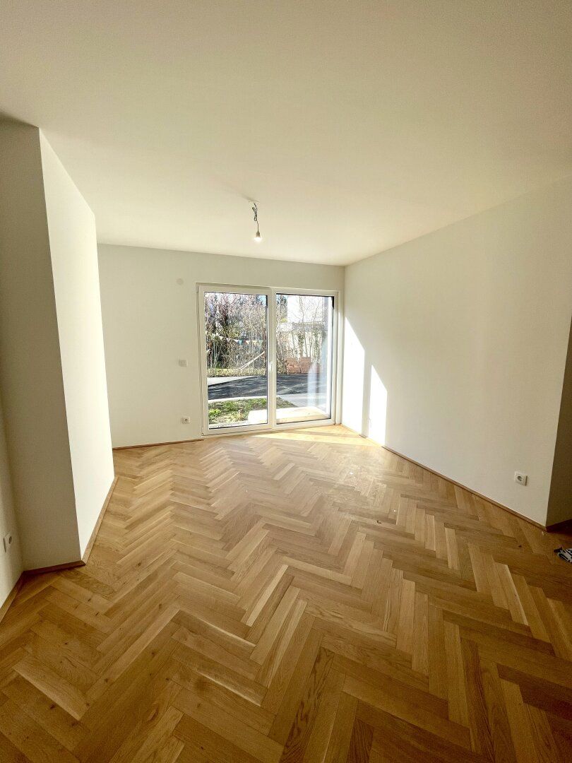 ERSTBEZUG! Traumhafte helle Gartenwohnung mit Fußbodenheizung und Luftwärmepumpe
