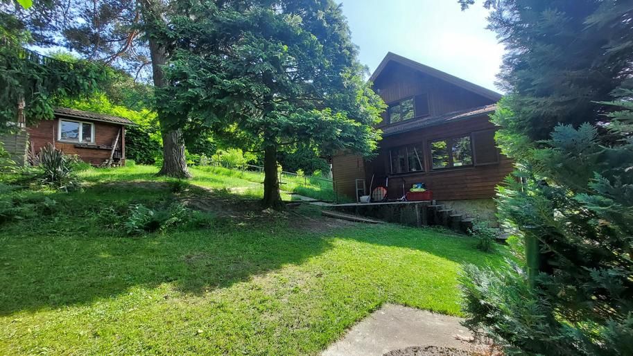 NEUER PREIS! Ausbaufähiges Holzhaus in Grünlage!